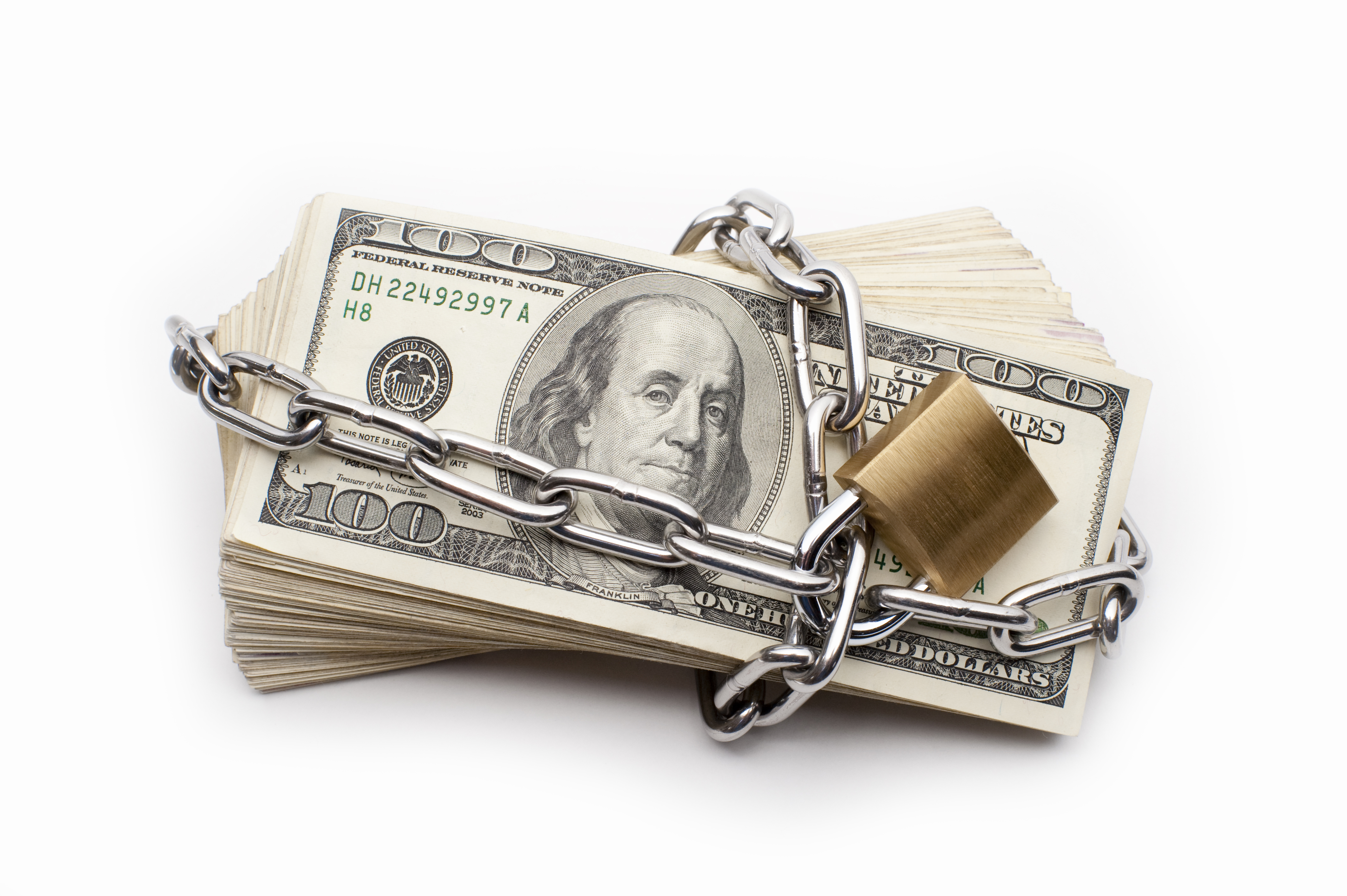 Pile of Cash Secured by a Chain and Padlock